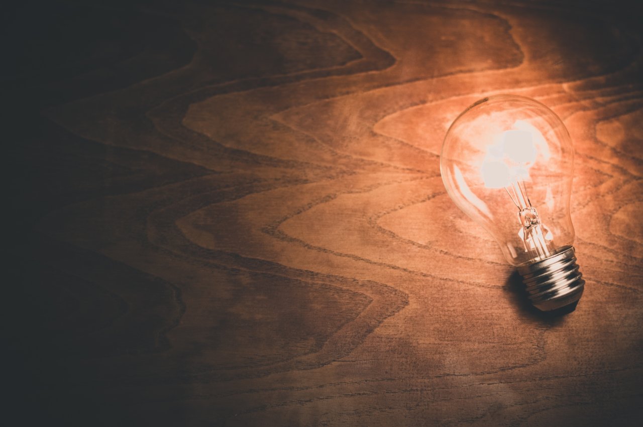 A light bulb shining on wood